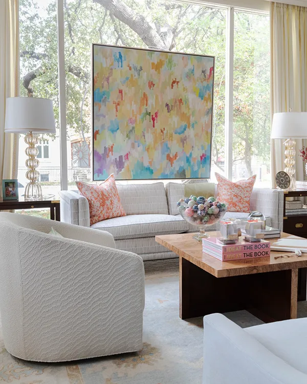 Richly colored Robert Rea painting in front of window