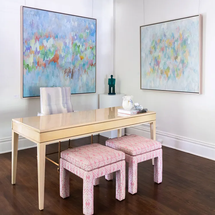 Two Rea paintings hanging