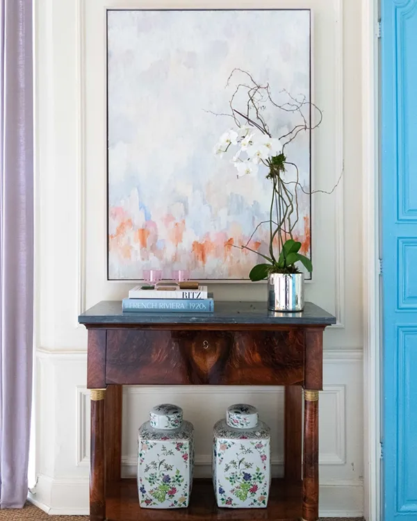 Painting of whites, greys with a touch of coral